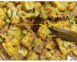 A picture of step 3 of Gobhi Matar Alu Kassa.