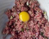 A picture of step 3 of Meat balls and beef sausages bitings in sauce.