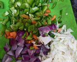 A picture of step 2 of Fried Plain Dhokla (without sugar) with veggies and Sauce.