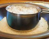 A picture of step 3 of Sweet Puttu (steamed rice cake from Kerala) with coconut.