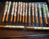 A picture of step 4 of Christmas chocolate covered pretzel rods.