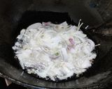 A picture of step 2 of Runner beans and potato fry with onion and onion greens.