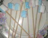 A picture of step 2 of 1 bite chocolatey marshmallow pops.