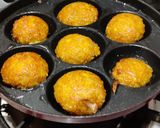 A picture of step 4 of Corn fritters in appe pan.
