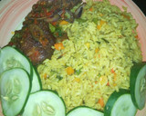 A picture of step 10 of Fried rice with peppered chicken dressed with cucumber.