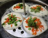A picture of step 3 of Oats mixed idli batter vegetables Idli Chutney.