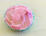 A picture of step 14 of Eggless cupcakesDecorated with buttercream, fondant and marshmallows.