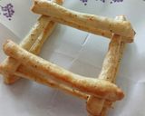 A picture of step 3 of Cacio and pepe breadsticks with prosciutto and goat's cheese.