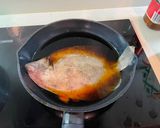 A picture of step 3 of Japanese style boiled plaice.
