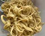 A picture of step 2 of Thai style egg noodles stir-fry served with fried egg.