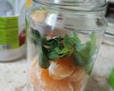 A picture of step 2 of Orange Mojito 🍊.