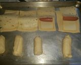 A picture of step 4 of Cheesy dog roll ups.