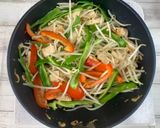 A picture of step 4 of Shiitake powder adds the Umami taste - fried rice noodles with plenty of chicken.