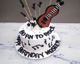 A picture of step 5 of Birthday cake music theme top on fondant guitar 🎸🎸🎸.