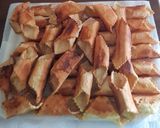 Foto del passaggio 10 della ricetta Cannoli ripieni di ricotta, scaglie di cioccolato e canditi