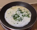 A picture of step 2 of Japanese rolled omelette.