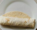A picture of step 6 of Mexican chicken enchiladas.