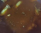 A picture of step 9 of Aloo chicken.