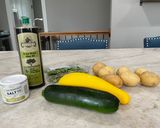 A picture of step 1 of Potato, Zucchini, and Yellow Squash Tourlou.