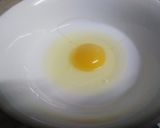 A picture of step 5 of Orange coloured Egg Pudding.