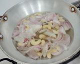 A picture of step 3 of Mushroom Masala in red gravy.