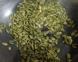 A picture of step 1 of Masala Roasted Pumpkin Seeds.
