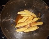 A picture of step 2 of Baked rosemary potatoe wedges.