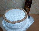 A picture of step 7 of Chocolate Guinness cake with whipped cream icing.
