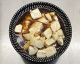 A picture of step 7 of Steamed tofu with sweet soy dressing sauce and spring onions.