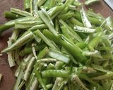 A picture of step 1 of Green chilli pickles.