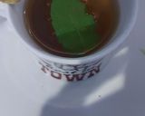 A picture of step 4 of Cardamom and tulsi tea.