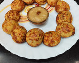 A picture of step 5 of Moong Dal Appe with vegetables.