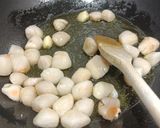 A picture of step 1 of Spaghetti with scallops and squid ink.