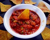 A picture of step 6 of Indian style simple Salsa nachos.