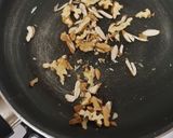 A picture of step 3 of French beans tossed with nuts and feta cheese salad.