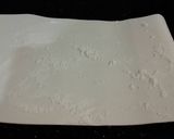 A picture of step 13 of Chocolate Strawberry Ice Cream Cake Roll.