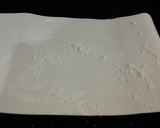 A picture of step 13 of Chocolate Strawberry Ice Cream Cake Roll.