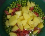 A picture of step 1 of Potato,Peas & Carrot.