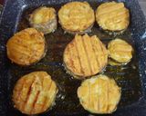 A picture of step 4 of Begun Bhaja aka Brinjal fritters.