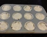 A picture of step 12 of White Chocolate Truffle Cupcakes with Whipped White Chocolate Mascarpone Frosting.