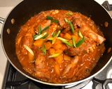 A picture of step 6 of Korean kimchi pork rib stew.