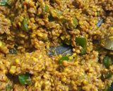 A picture of step 4 of Potoler dolma pointed gourd with spicy filling.