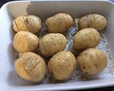 A picture of step 2 of Hassleback rosemary and garlic new potatoes.