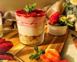 A picture of step 15 of 3 layered Strawberry Cheesecake.