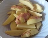 A picture of step 3 of Spicy potato wedges.
