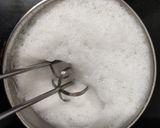 A picture of step 2 of Biryani chai, layered tea with spices.