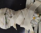 A picture of step 3 of Mummy kabab wrapped, hand garlic toast and eyeball punch.
