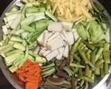 A picture of step 1 of Lentil Fritters in mix veg curry.