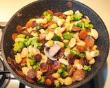 A picture of step 12 of Cavatelli with Purple Carrots, Broccoli Rabe, and Cremini Mushrooms.