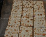 A picture of step 2 of Saltine chocolate crackers.